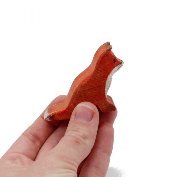 Red Fox Child Sitting In Hand Wooden Figure