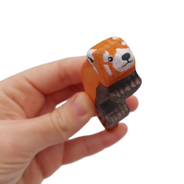 Red Panda wooden figure in Hand - by Good Shepherd Toys